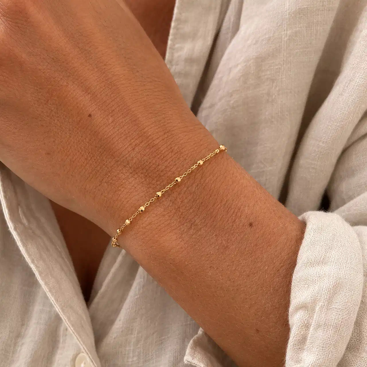 ARMBÅND FACETTEREDE KUGLER 17+2 CM  8 KT.